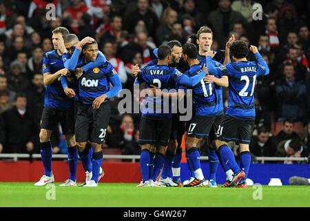 Manchester United's Antonio Valencia (third left) celebrates scoring their first goal of the game with team-mates Stock Photo