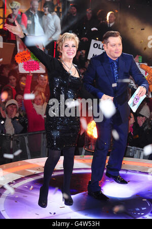 Winner Denise Welch (left) with Brian Dowling as she leaves the Celebrity Big Brother House during the live final at the Elstree Studios, Borehamwood. Stock Photo