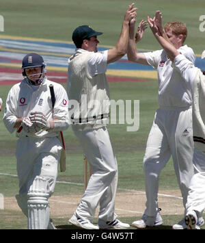 South African captain Hansie Cronje, celebrates with Shaun Pollock, as Michael Atherton departs for the pavilion after scoring only 7 runs, during the last day of the rain affected 5th Test at Centurion Park. Stock Photo