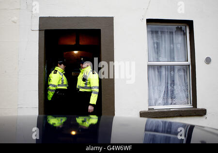 Gardai at the scene on Aughrim Street in the Stoneybatter area of north Dublin, where a flat has been sealed off for forensic examination as gardai hunt the killer of an African woman whose body was found dumped in a suitcase on Sunday. Stock Photo