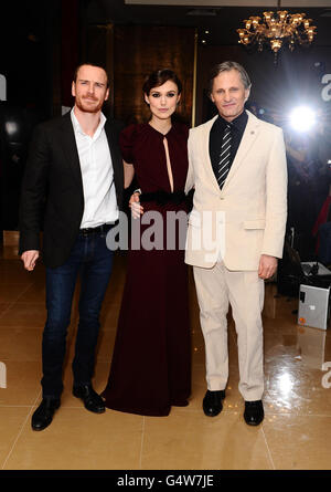 (Left - right) Michael Fassbender, Keira Knightley and Viggo Mortensen arriving at the gala premiere of A Dangerous Method at The May Fair Hotel, London. Stock Photo