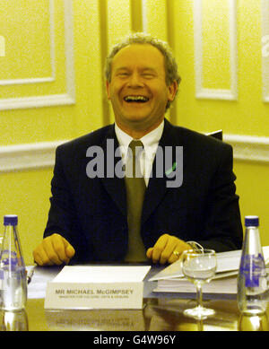 Martin McGuinness Minister for Education in Northern Ireland, at the first meeting of the new Ulster Cabinet, as it it was pointed out to him by David Trimble that he was sat in Ulster Unionist Michael McGimpseys seat. Stock Photo
