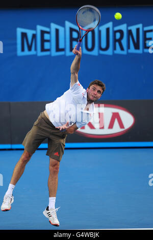 Tennis - 2012 Australian Open - Day Two - Melbourne Park. France's Gilles Simon in action against Thailand's Danai Udomchoke Stock Photo