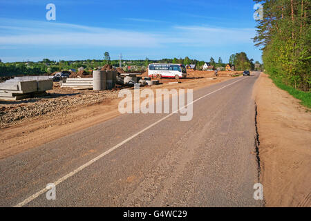 Construction of Vitebsk hydroelectric power station.View of the dam between river and road. Stock Photo