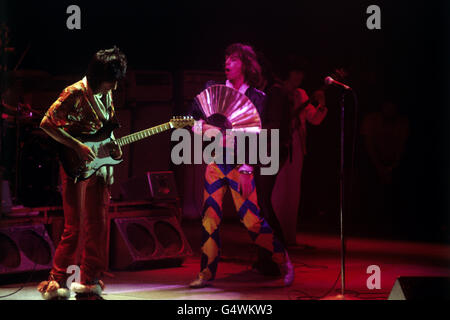 The Rolling Stones on stage during the first British concert of their European Tour. From left: Ronnie Wood, Mick Jagger, Keith Richards and Bill Wyman (background) Stock Photo