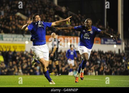 Everton's Denis Stracqualursi (left) celebrates scoring his side's first goal of the match with teammate Magaye Gueye (right) Stock Photo