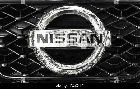 St-Petersburg, Russia - May 15, 2016: Nissan car logo on a front radiator grille of Nissan X-Trail SUV, closeup photo Stock Photo