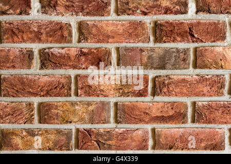 Red brick wall fragment background texture. Close up Stock Photo