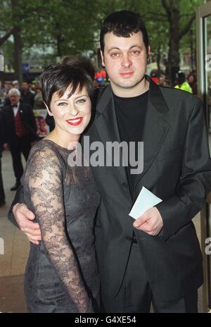 Singer and actress Lisa Stansfield arrives with her husband Ian Devaney at the Odeon in Leicester Square, London, for the premiere of the film 'Swing' , in which Ms Stansfield she stars with Hugo Speer and Alexei Sayle. Stock Photo