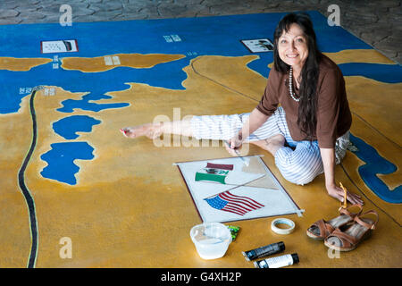 Artist Carol DeMoss working on mural at Palo Alto Battlefield National Park, Brownsville; Texas, USA Stock Photo
