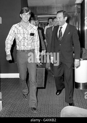 Prince Andrew, 17, carries his own suitcase at Heathrow Airport, London, on his return from Canada where he has been at Lakefield College School in Ontario for six months under an exchange scheme with Gordonstoun school. Stock Photo