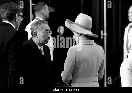 Queen Elizabeth II greets Emperor Hirohito of Japan at Victoria Station, at the start of his State visit to Britain. Stock Photo