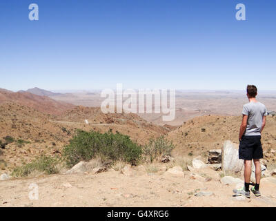Namibia, Khomas, Spreetshoogte Pass, Namib Desert, Man enjoys the view on the Pass (1275 m) Stock Photo