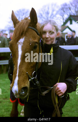 Stable girl Emma Smith with Martin Pipe's trained 'Through the Rye', who won the Sponsor A Race at Folkestone Juvenile Novices' Hurdle, ridden by Tony McCoy. Pipe, with this win, became the most successful trainer in British racing history. Stock Photo