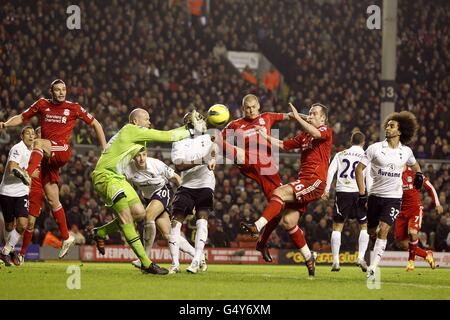 Tottenham Hotspur's goalkeeper Brad Friedel challenges for the ball with Liverpool's Charlie Adam (no.26) and Martin Skrtel (third from right) Stock Photo