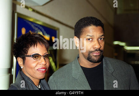 Actor Denzel Washington with his wife Pauletta Pearson arrive at the celebrity screening of his latest film, The Hurricane, at the Warner Village Cinema in London's Leicester Square. Stock Photo