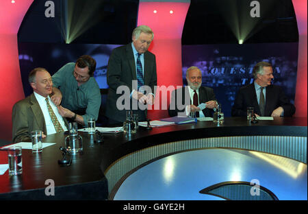 Ken Livingstone gets miked up before the recording of BBC's Question Time, as programme presenter David Dimbleby, and Labour London Mayoral candidate Frank Dobson with the Conservative Mayoral candidate Steve Norris (L-R) prepare for the programme. Stock Photo