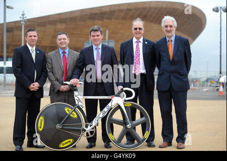(left to right) Chair Glasgow Life George Redmond, Executive Member for Culture and Leisure Manchester Mike Amesbury, Minister for Sport and the Olympics Hugh Robertson, Charman of Lee Valley Regional Park Authority Derrick Ashley and President of British Cycling Brian Cookson OBE pose for a photo outside the Velodrome in the Olympic Park, London. Stock Photo