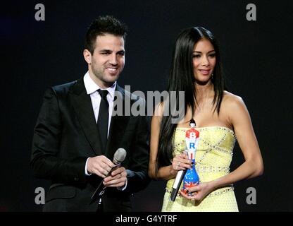 Cesc Fabregas and Nicole Scherzinger on stage during the 2012 Brit awards at The O2 Arena, London. Stock Photo