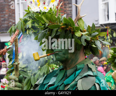 Man in costume smoking pipe at Hastings Jack in the Green Mayday festival Stock Photo