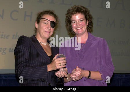 Sunday Times correspondent Marie Colvin (l) is awarded the Pilkington Window to the World Award during the 'Women of the year Lunch 2001' at the Savoy Hotel in London. Stock Photo