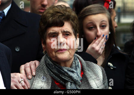 Luisa Mastrobuono (grey coat) surround by family members speaks outside Wolverhampton Crown Court today after Ireneusz Bartnowski was found guilty of the murder of her brother Guiseppe Massaro and his wife Caterina. Stock Photo