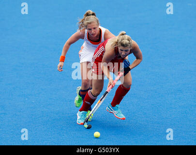 Netherland's Xan de Waard and Great Britain's Georgie Twigg during the pool match between Netherlands and Great Britain on day two of the FIH Women's Champions Trophy at the Queen Elizabeth Olympic Park, London. Stock Photo
