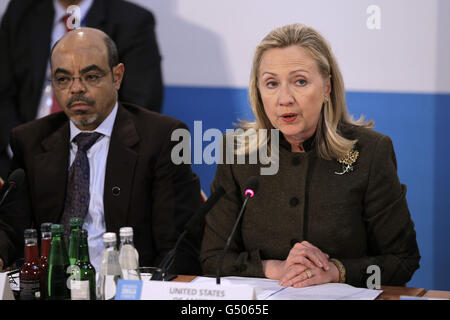 U.S. Secretary of State Hillary Rodham Clinton makes an address flanked by Ethiopia Prime Minister Meles Zenawi during the London Conference on Somalia at Lancaster House in London. Stock Photo