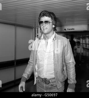 American actor Patrick Duffy, who plays Bobby Ewing in the television series 'Dallas', arriving at Heathrow Airport, London, from Los Angeles to make a promotional video. Stock Photo