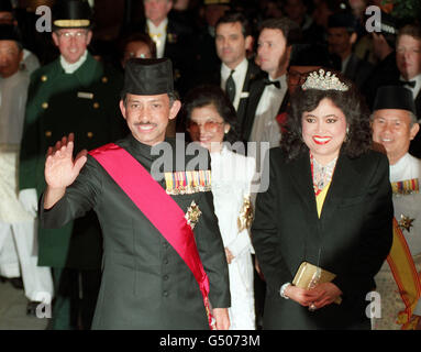 Sultan Hassanal Bolkiah of Brunei (R) and his wife Pengiran Anak Saleha ...