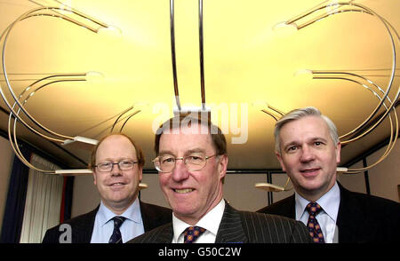 From left to right: Bank of Scotland's Gordon McQueen, divisional chief executive for treasury; Peter Burt, group chief executive; George Mitchell, divisional chief executive in corporate banking, at their City head office, London. * The group's underlying earnings hit record levels despite Bank of Scotland's failed bid to take over NatWest knocking 54 million off its profits for the last year. Stock Photo