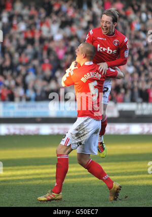 Charlton Athletic's Danny Green (facing) celebrates with goal scorer Michael Morrison during the npower League One match at The Valley, London. Stock Photo