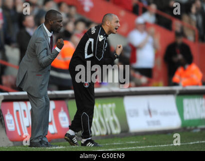 Charlton Athletic manager Chris Powell (left) and DamianMatthew encourage their team from the touch line during the npower League One match at The Valley, London. Stock Photo