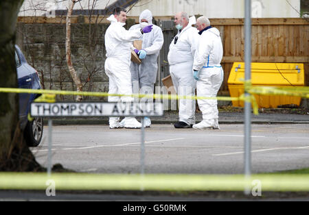 Police forensic officers gather evidence at the scene of a shooting where a man was shot dead during a police operation involving armed officers in Warrington, Cheshire.