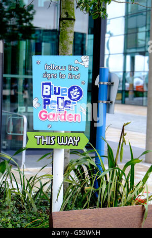 Sign saying 'Follow the signs to the Blue Peter Garden', MediaCityUK, Salford Quays, UK, Stock Photo