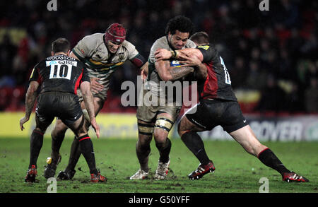 Rugby Union - Aviva Premiership - Saracens v Northampton Saints - Vicarage Road. Northampton's Samu Manoa is tackled by Saracens John Smit (right) during the Aviva Premiership match at Vicarage Road, Watford. Stock Photo