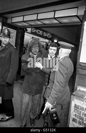 Face blackened, one of the people involved the tube crash at Moorgate station, is helped from the station to a waiting ambulance. Forty-three people were killed and over 50 injured when a tube train failed to stop at a platform and ended up hurtling down a blind tunnel and crashing into a brick wall. Stock Photo