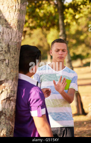 Kids in park smoking cigarette. Concept of smoking and social issues ...