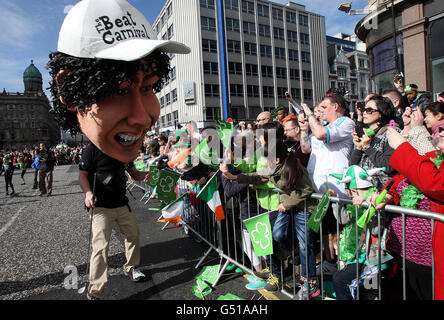 The St Patrick's Day Parade moves off from Belfast City Hall. Stock Photo