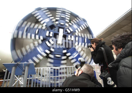 Photographers photograph a tunnelling machine during the official unveiling of the first two of eight Crossrail tunnelling machines, at the Crossrail Westbourne Park construction site in west London. Stock Photo