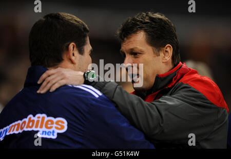 Derby County manager Nigel Clough and Nottingham Forest manager Steve Cotterill (right) during the npower Football League Championship match at Pride Park, Derby. Stock Photo