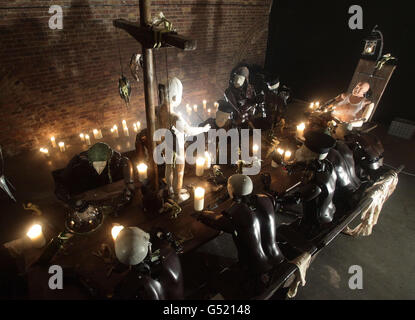 An art installation by Giles Walker entitled 'Last Supper' - a fully animated sculpture consisting of thirteen mechanical figures who interact around a table - at the Black Rat Projects gallery in Shoreditch, east London. Stock Photo