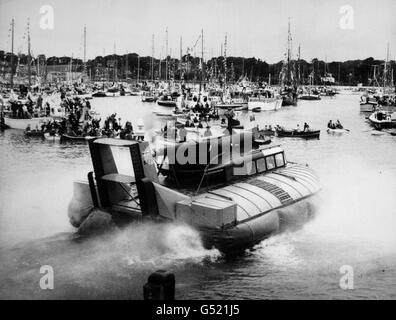 Queen Elizabeth II and the Duke of Edinburgh leaves the crowded harbour at Yarmouth, Isle of Wight in a hovercraft at the conclusion of the Royal visit to the island. Stock Photo