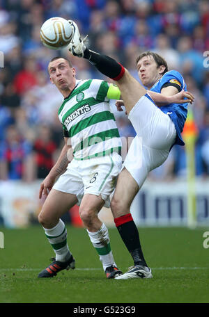 Rangers' Sasa Papac and Celtic's Scott Brown (left) in action during the Clydesdale Bank Scottish Premier League match at Ibrox Stadium, Glasgow. Stock Photo