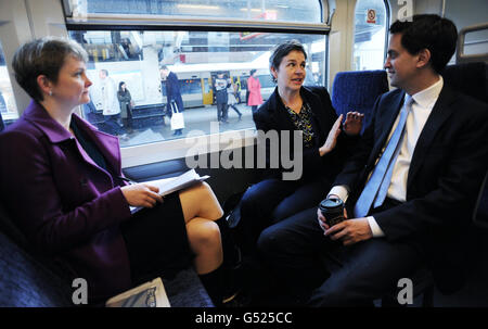 Labour leader Ed Miliband takes the train to Chislehurst with shadow cabinet members Mary Creagh (centre) and Yvette Cooper on their way to a a shadow cabinet meeting in Bromley. Stock Photo