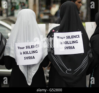 Members of the Federation of Student Islamic Societies in Dublin hold a flash mob on O'Connell Street to highlight human rights abuses by the Assad regime in Syria. Stock Photo