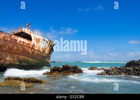 South Africa, Western Cape, Suiderstrand, rusty shipwreck on the coast ...