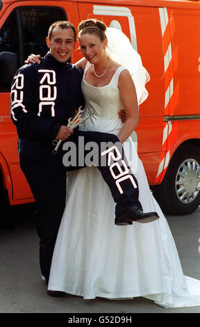 RAC patrolman Carlos Villamore with Charlotte Wood, who he met while repairing her broken down car, when her Ford Fiesta came to a halt on a roundabout in Welwyn Garden City. The couple married at St John the Baptist Church, Enfield, London. Stock Photo