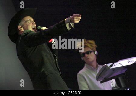 Singer Neil Tennant (L) and keyboard player Chris Lowe, of pop duo The Pet Shop Boys, performing on stage at the Glastonbury music Festival at Pilton, in Somerset. Stock Photo