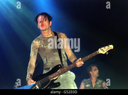 The bass player with American Industrial rock band Nine Inch Nails performing on stage at the Glastonbury Music Festival 2000 in Pilton, Somerset. Stock Photo